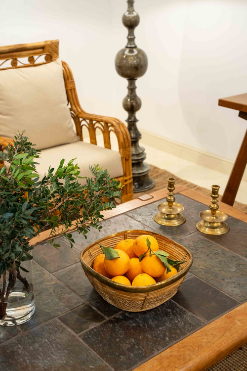 A brass mounted wicker basket