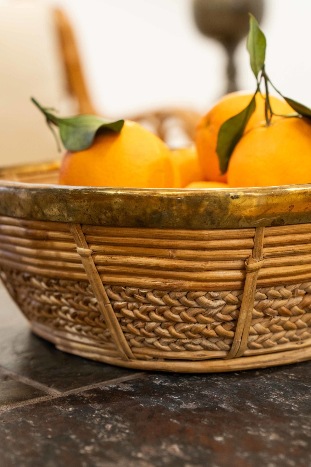 A brass mounted wicker basket