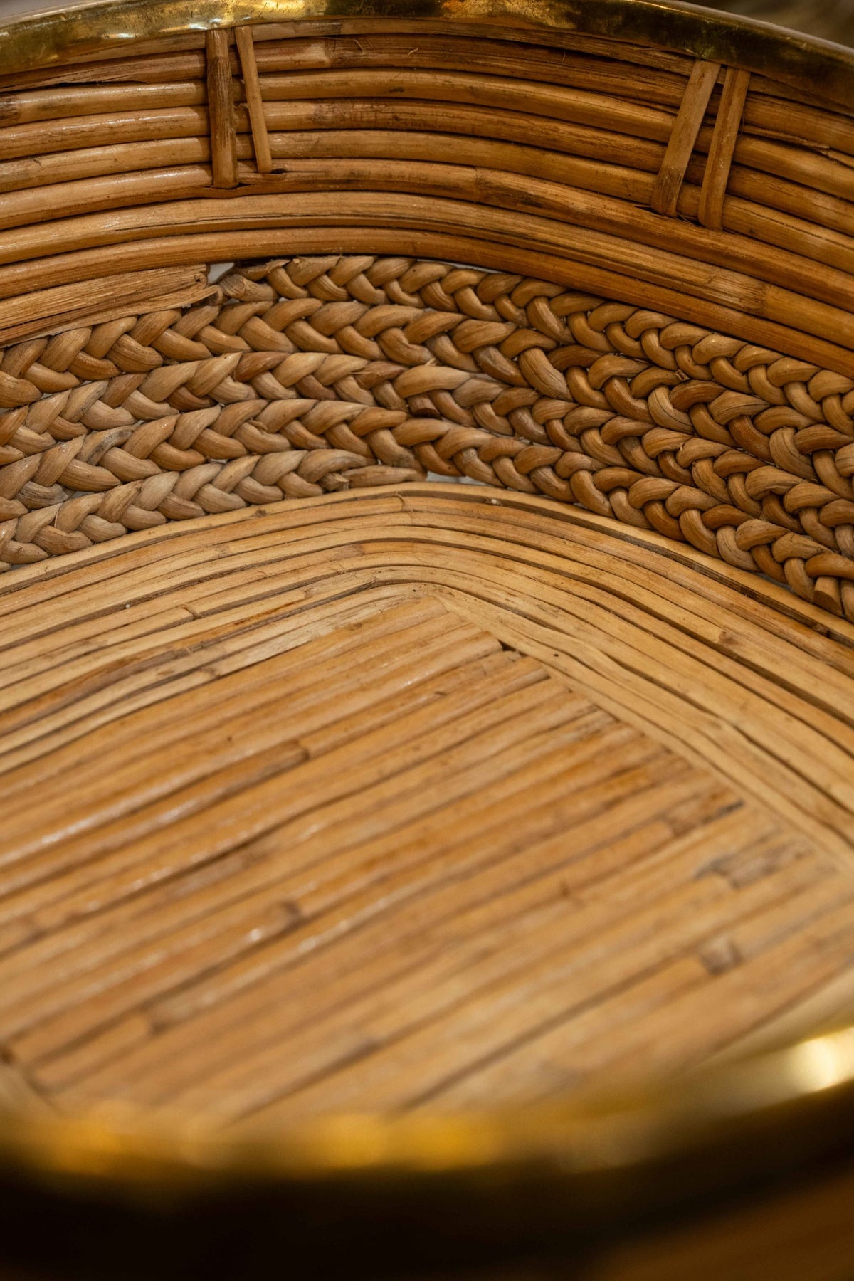 A brass mounted wicker basket