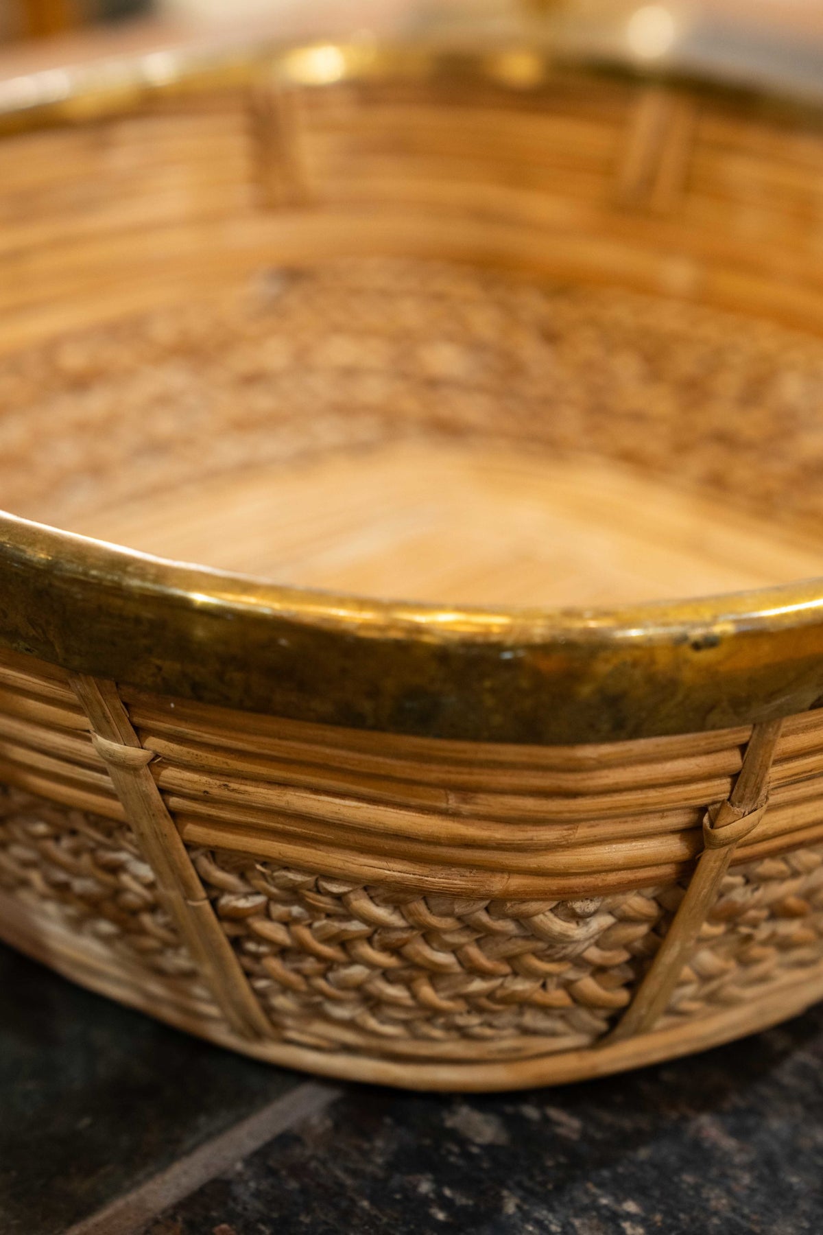 A brass mounted wicker basket