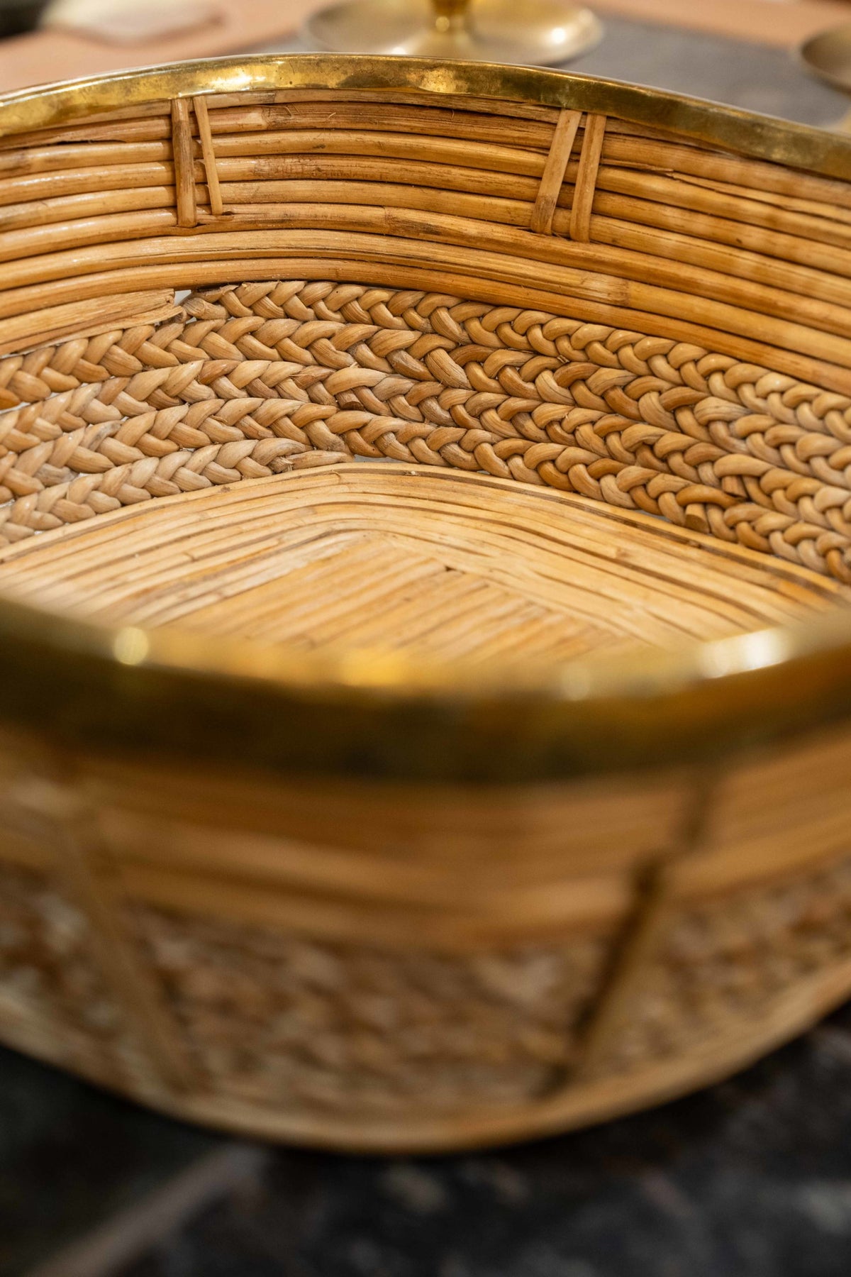 A brass mounted wicker basket