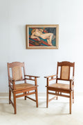 Pair of oak and and rattan armchairs