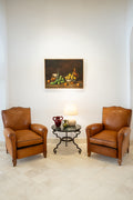 Paire de fauteuils en cuir
