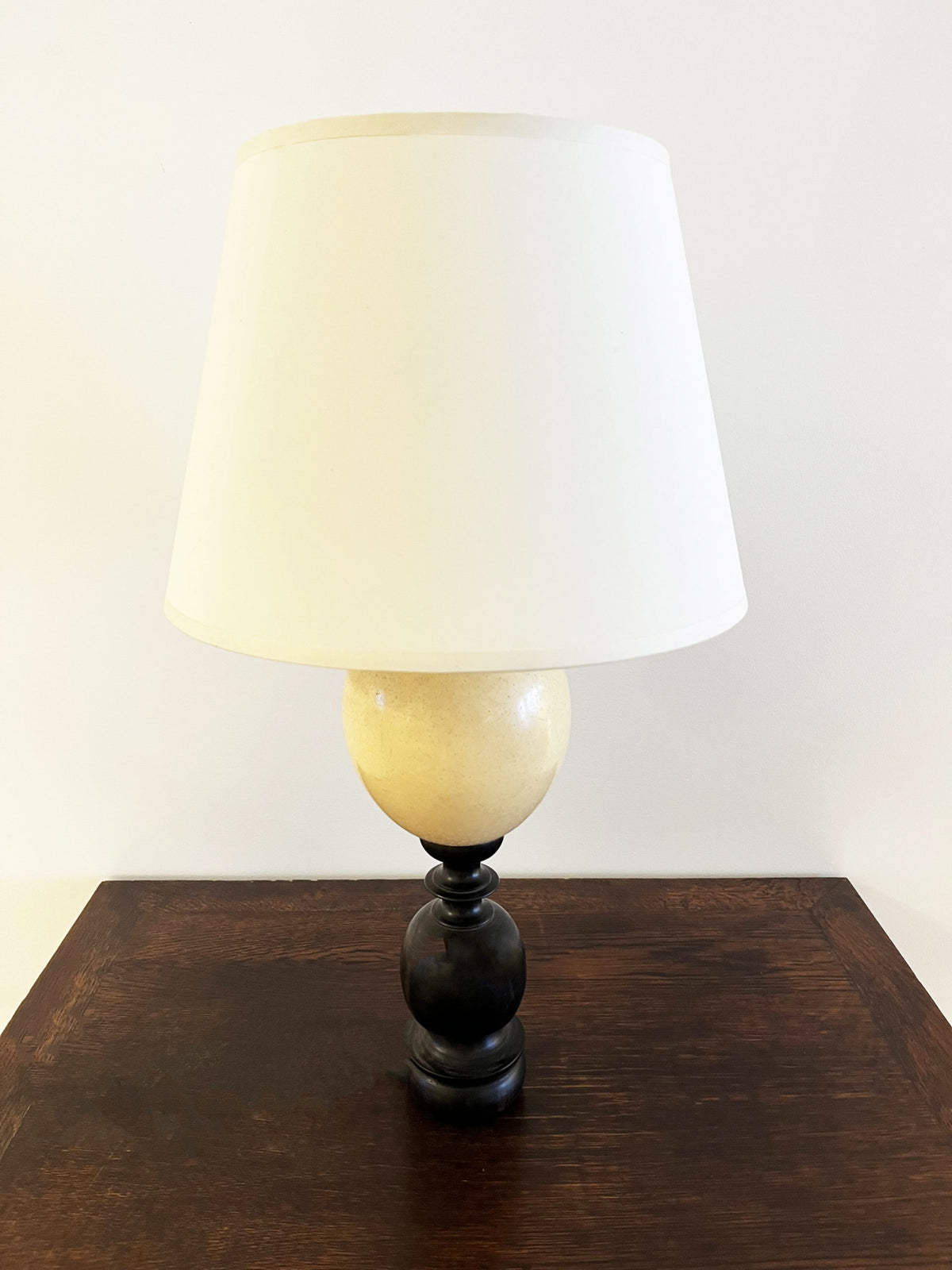 Turned ebony and ostrich egg lamp