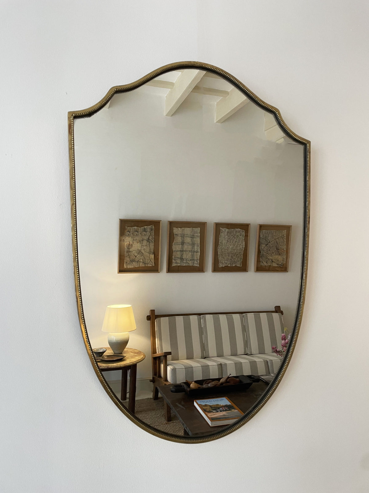 Brass shield mirror