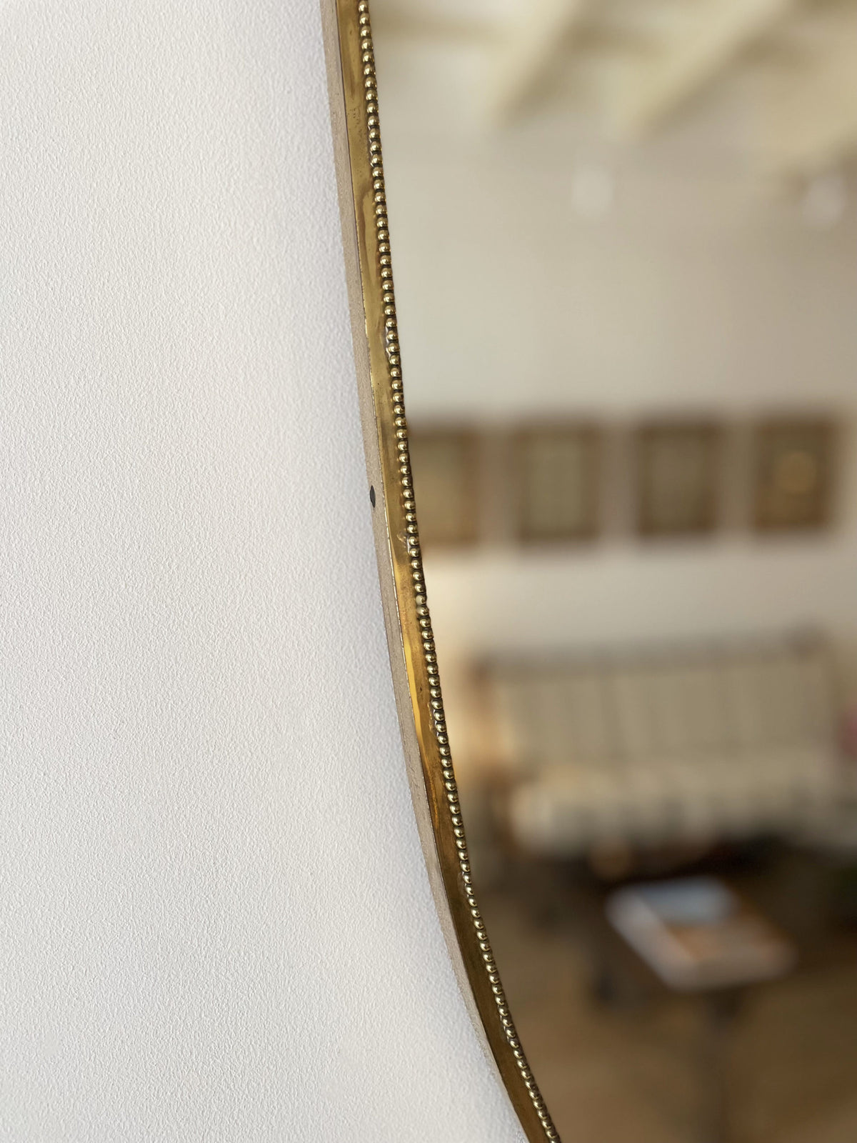 Brass shield mirror