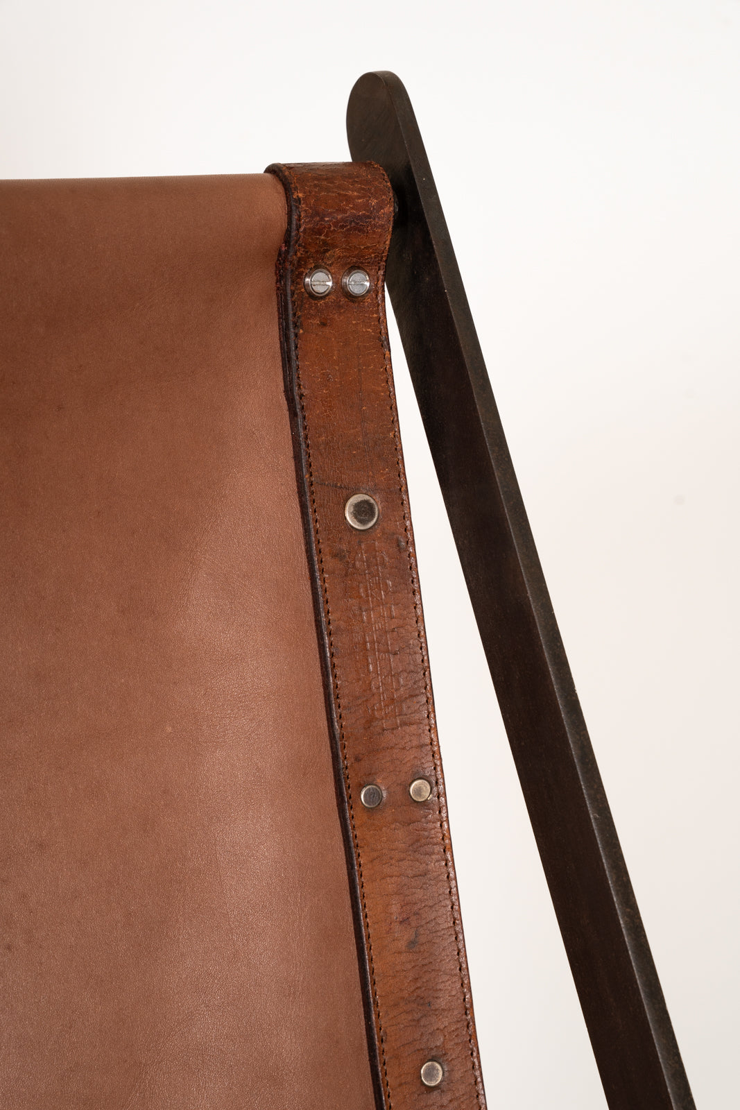 Fauteuil à bascule en cuir et fer forgé