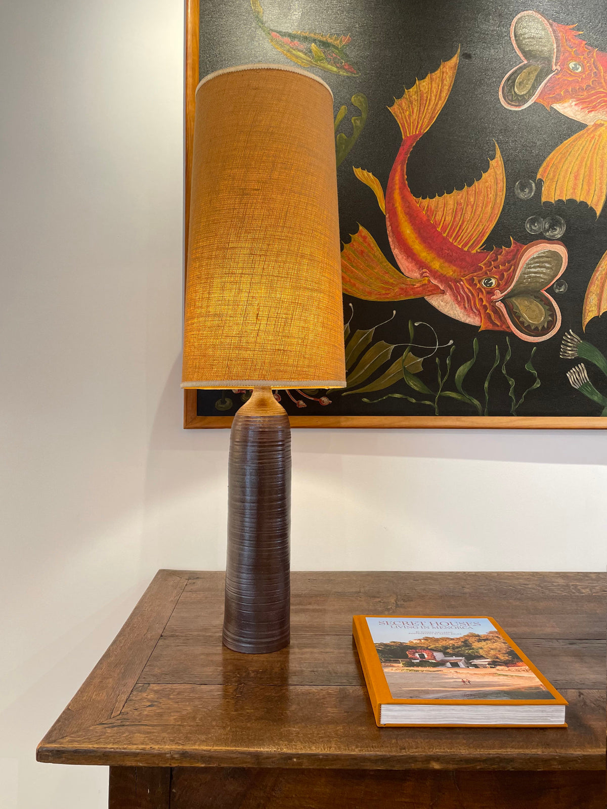 A tall hand wheel thrown stoneware lamp