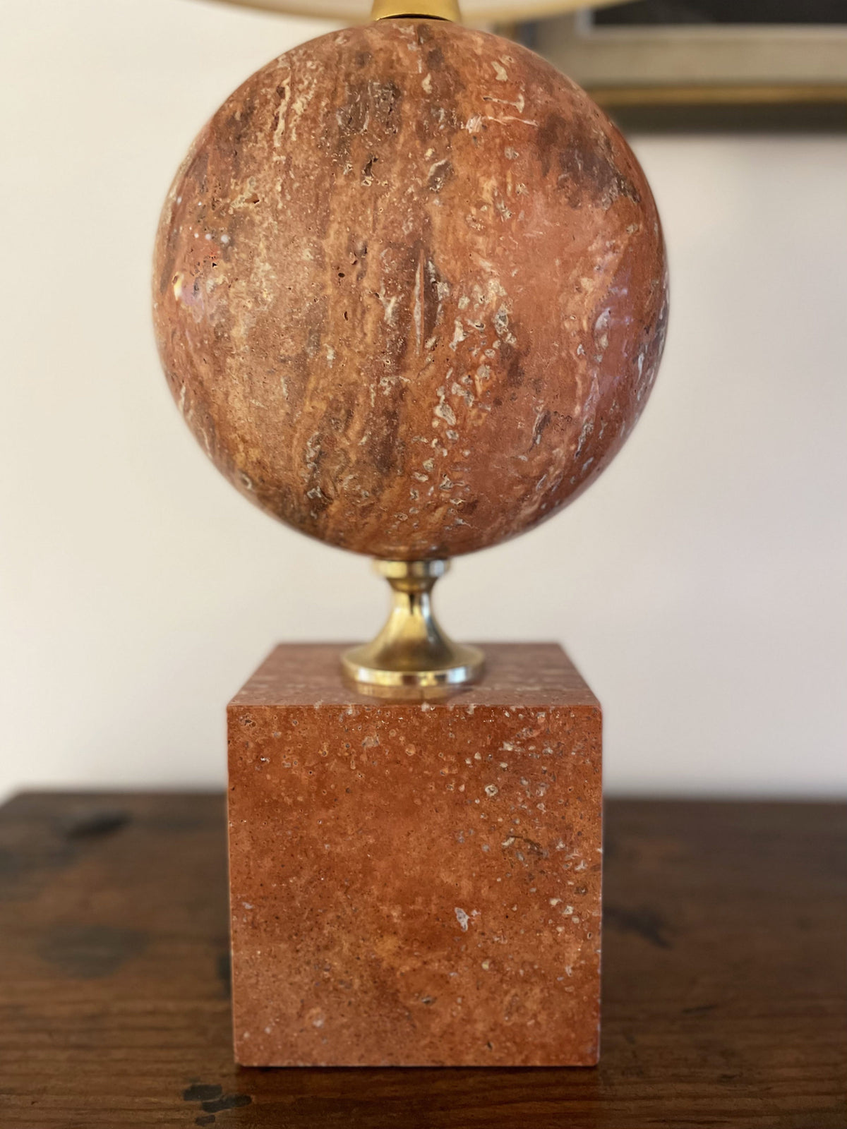 Tall lamp in red travertine and gilded brass
