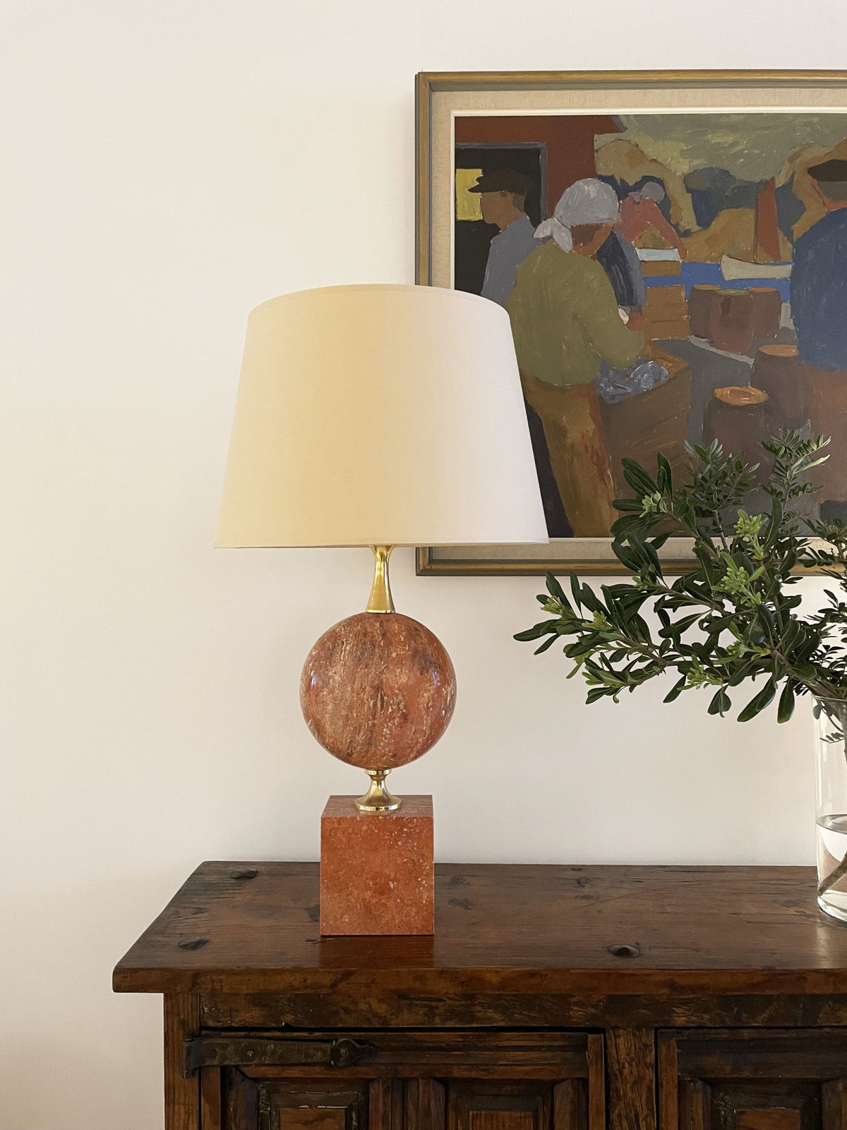 Tall lamp in red travertine and gilded brass