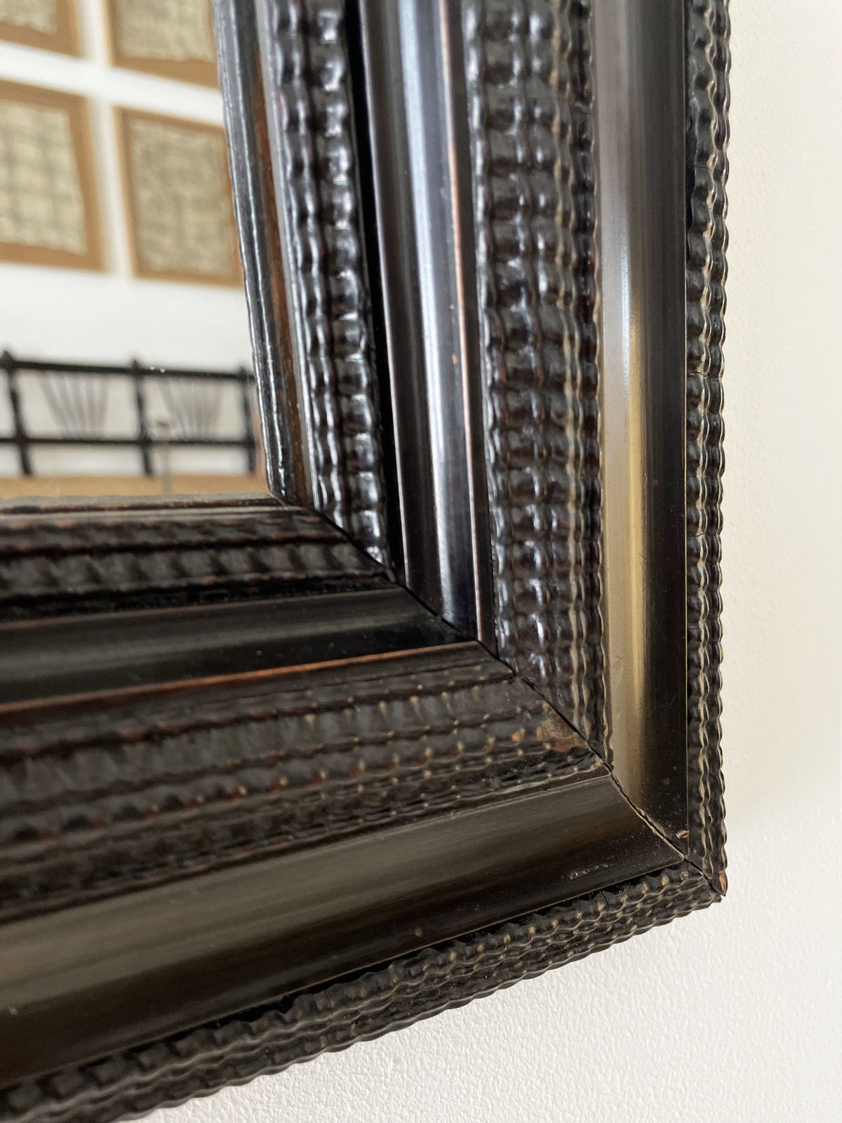 Flemish style ebonised ripple frame mirror