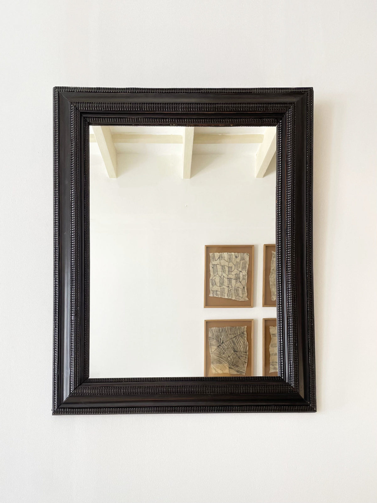 Flemish style ebonised ripple frame mirror