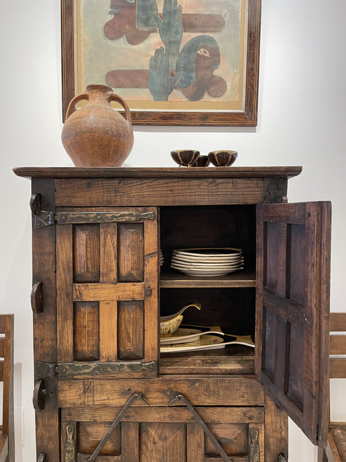 A unique Spanish solid oak and wrought iron cabinet