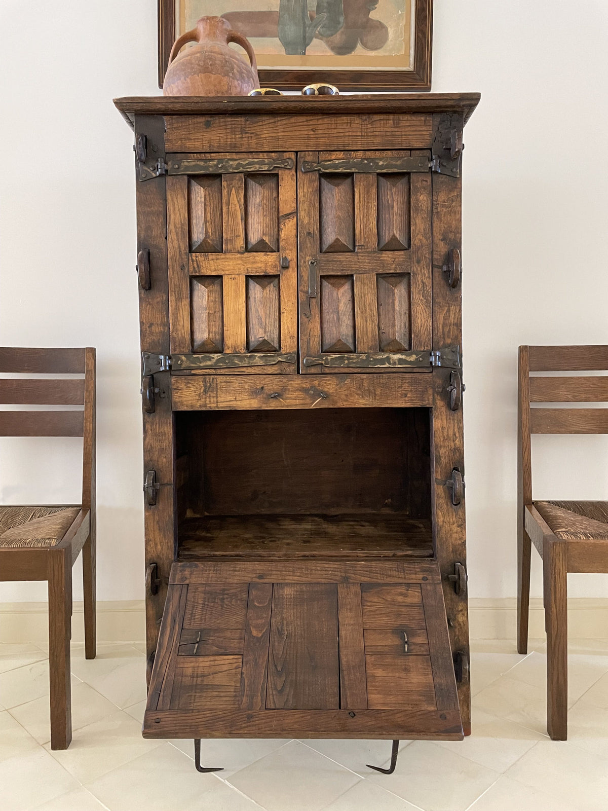 A unique Spanish solid oak and wrought iron cabinet