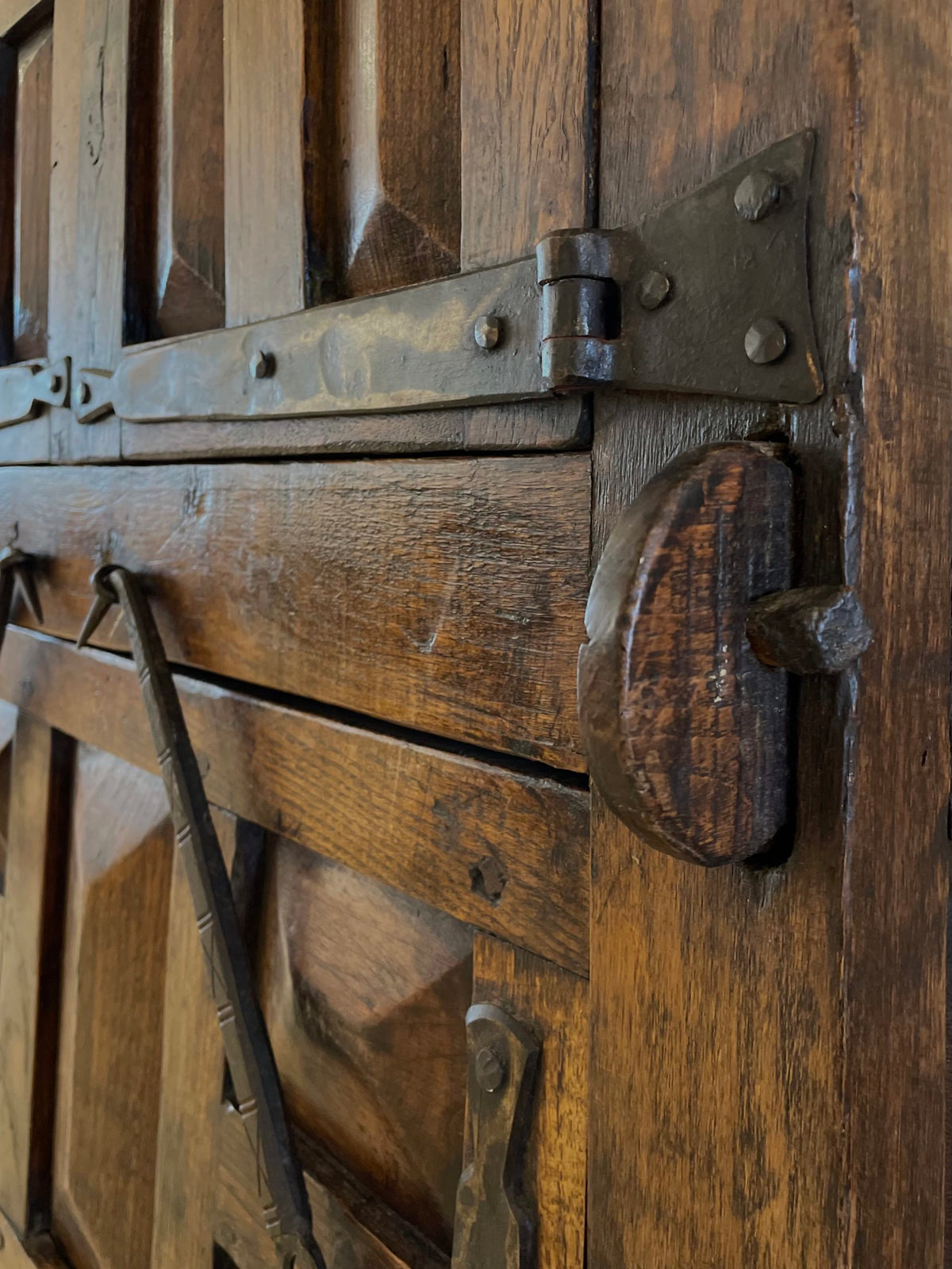 A unique Spanish solid oak and wrought iron cabinet