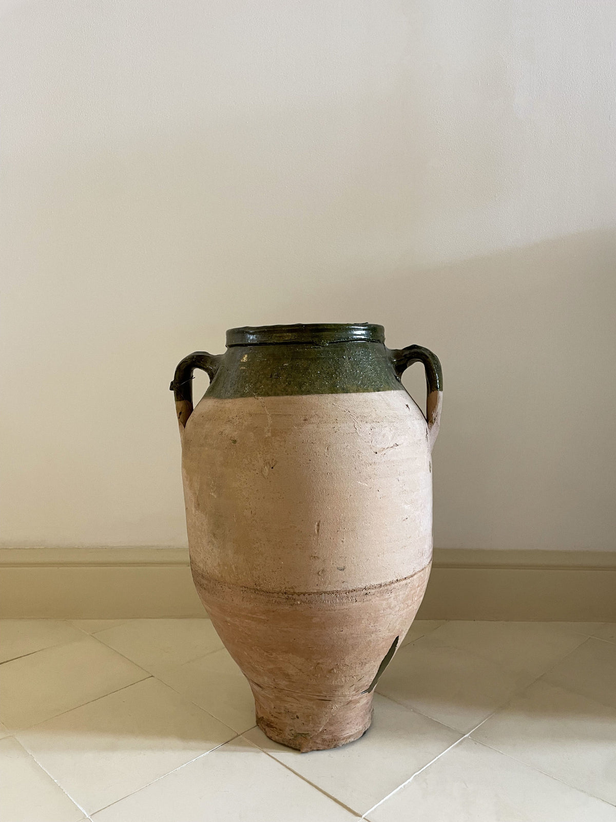 Large terracotta and green enameled jar