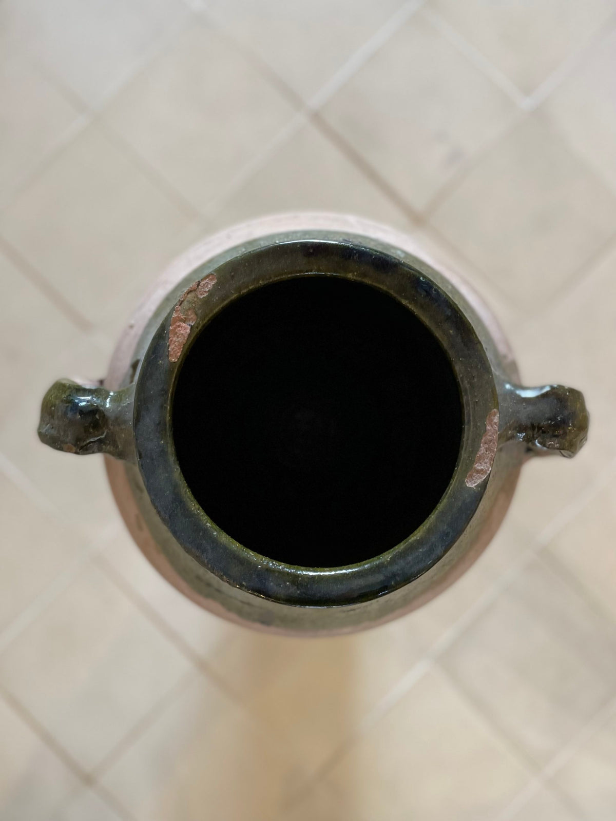 Large terracotta and green enameled jar