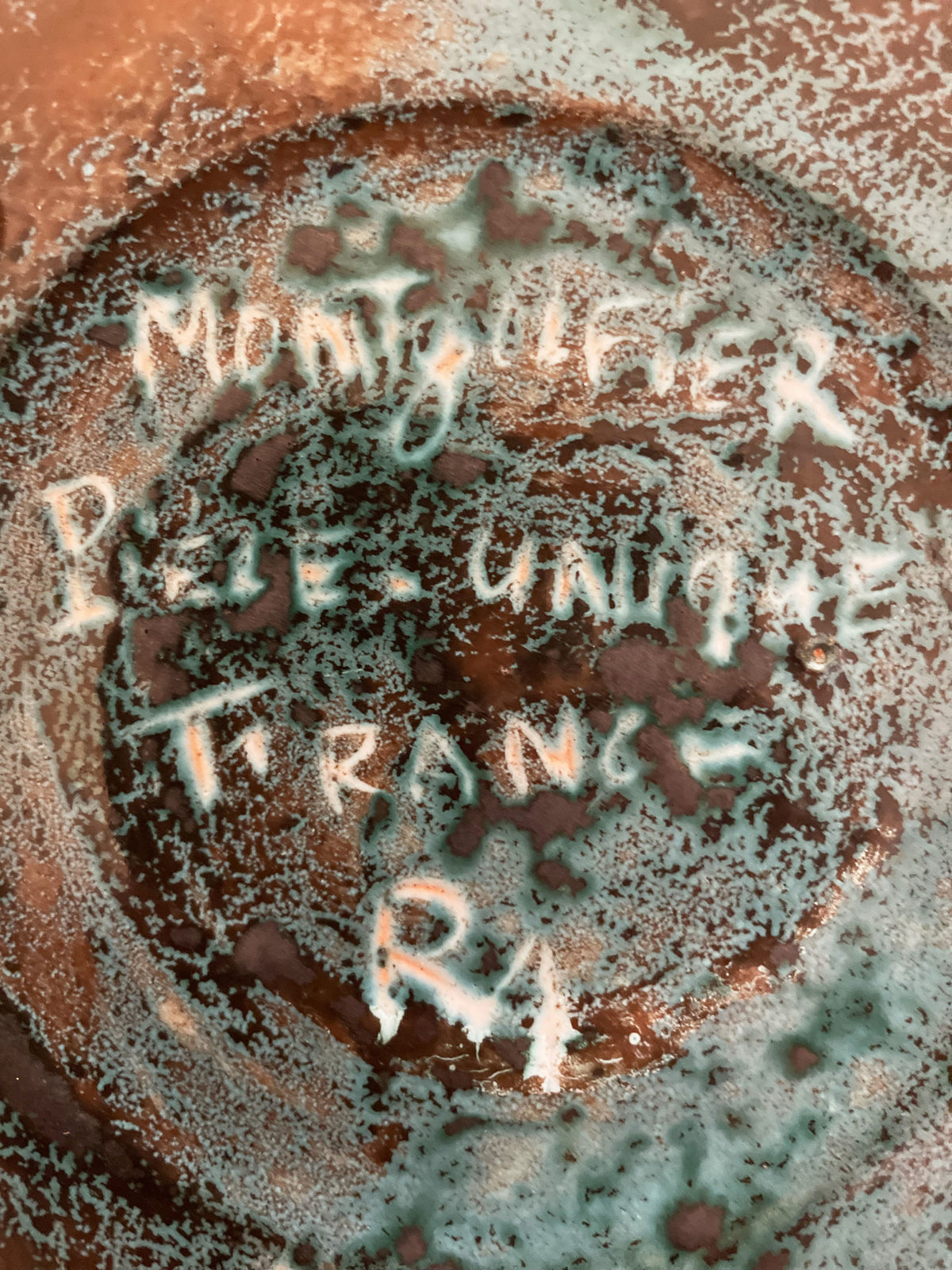 Large turquoise blue glazed ceramic bowl with a horse