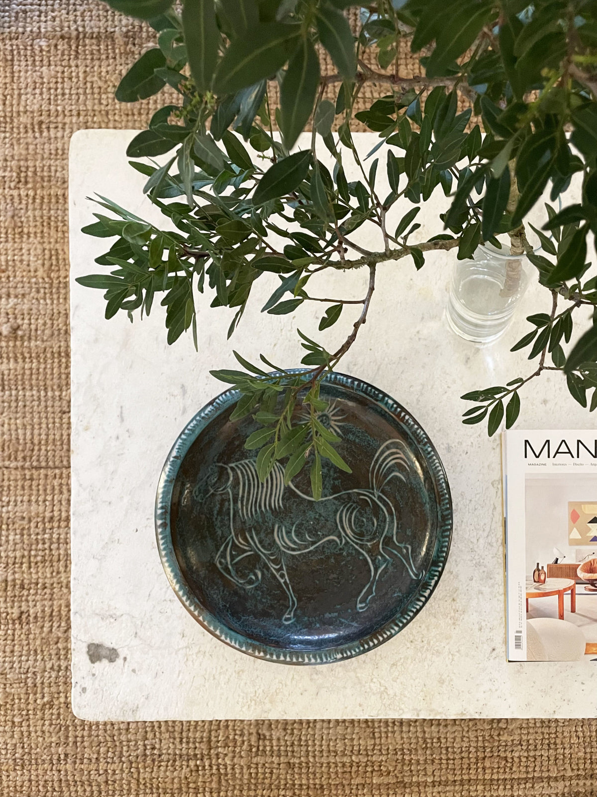 Large turquoise blue glazed ceramic bowl with a horse