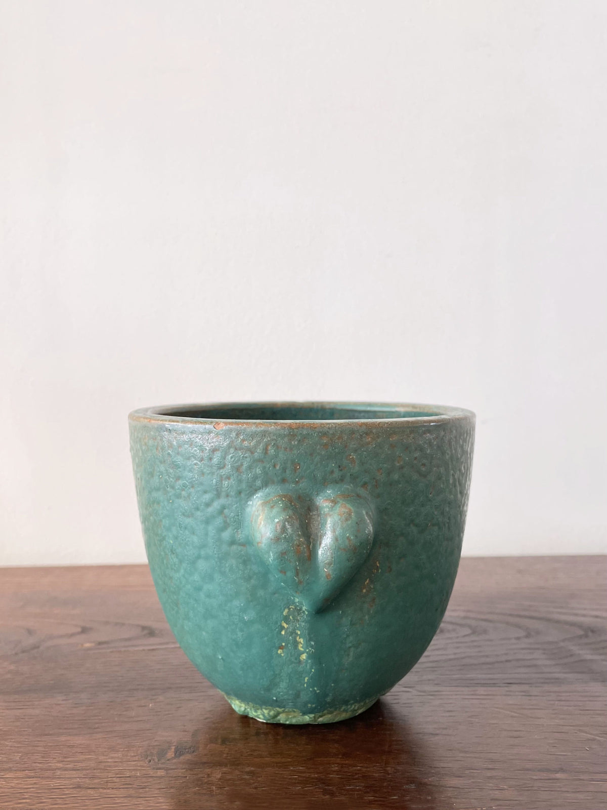 Green ceramic cup with two hearts