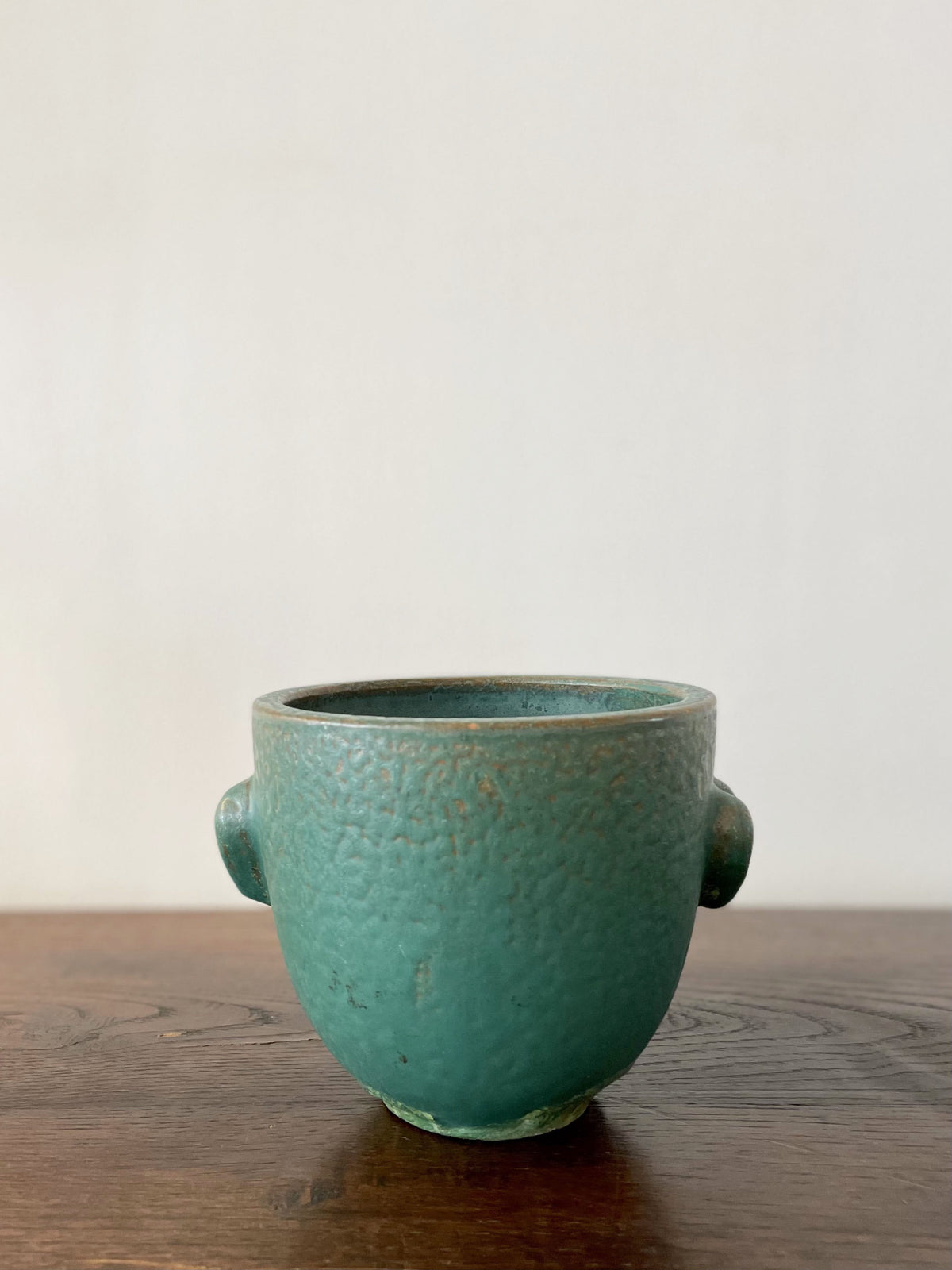 Green ceramic cup with two hearts