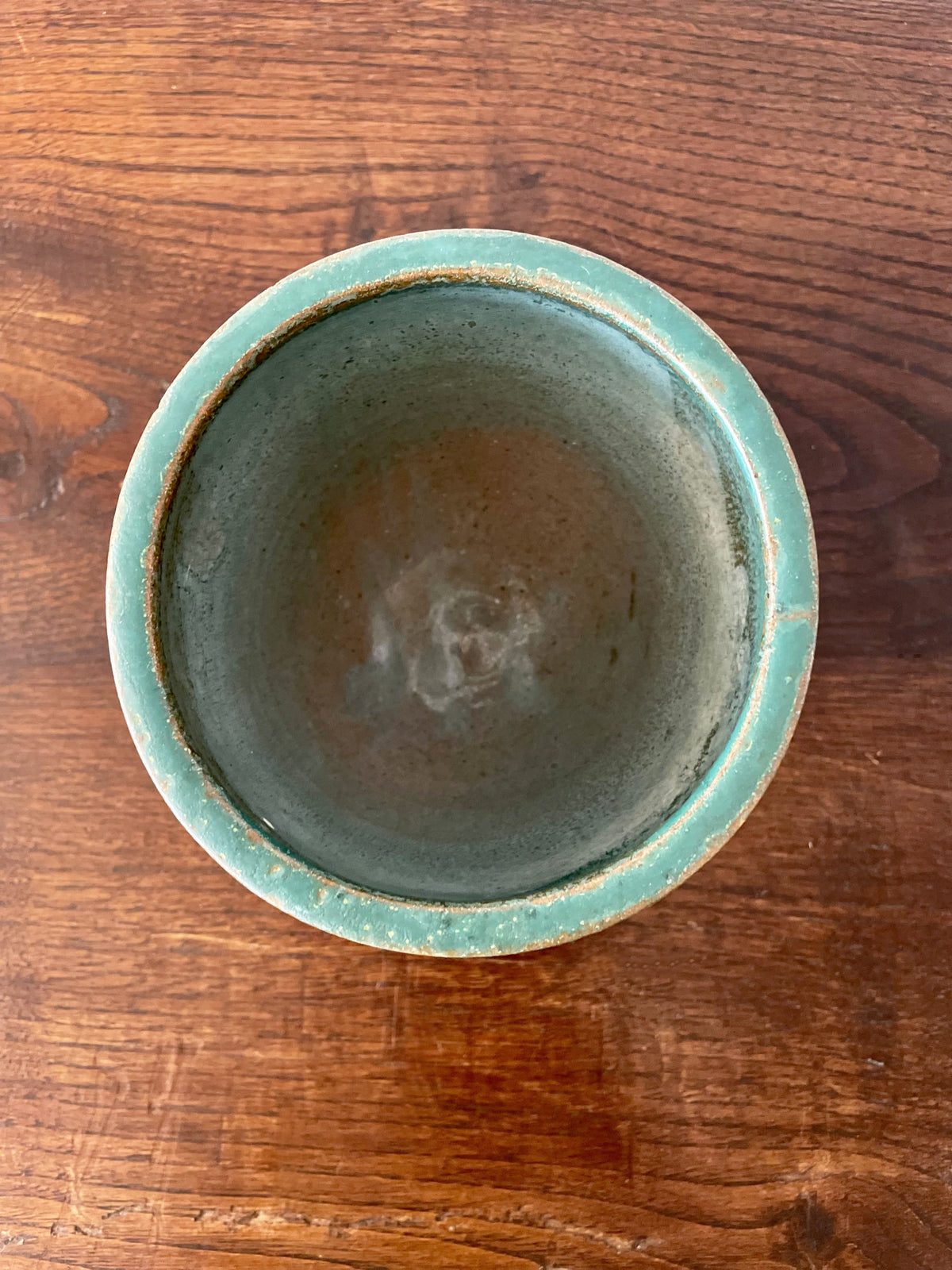 Green ceramic cup with two hearts