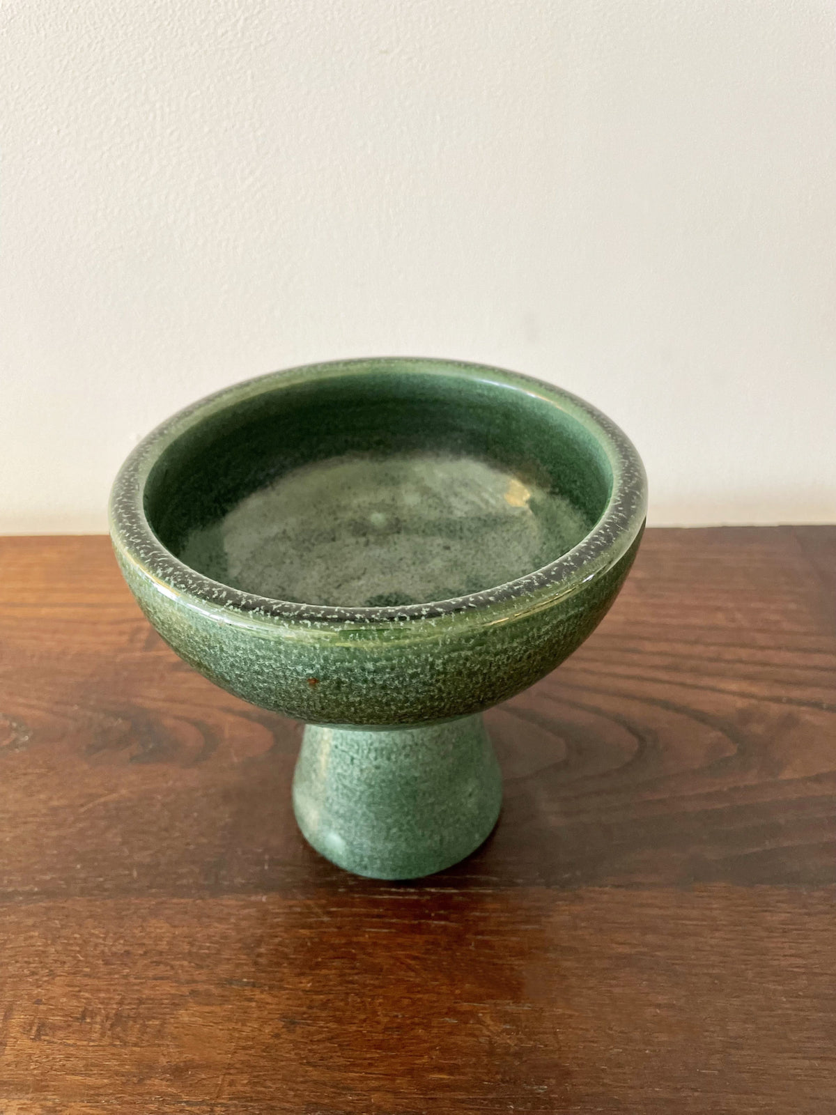 Glazed green ceramic cup