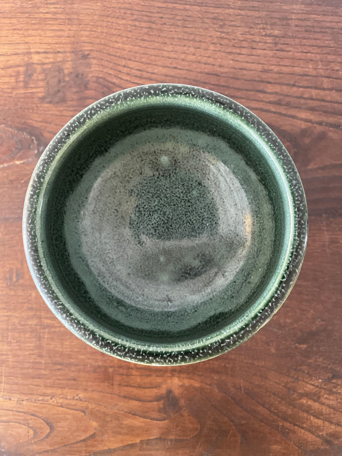 Glazed green ceramic cup
