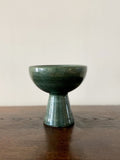 Glazed green ceramic cup