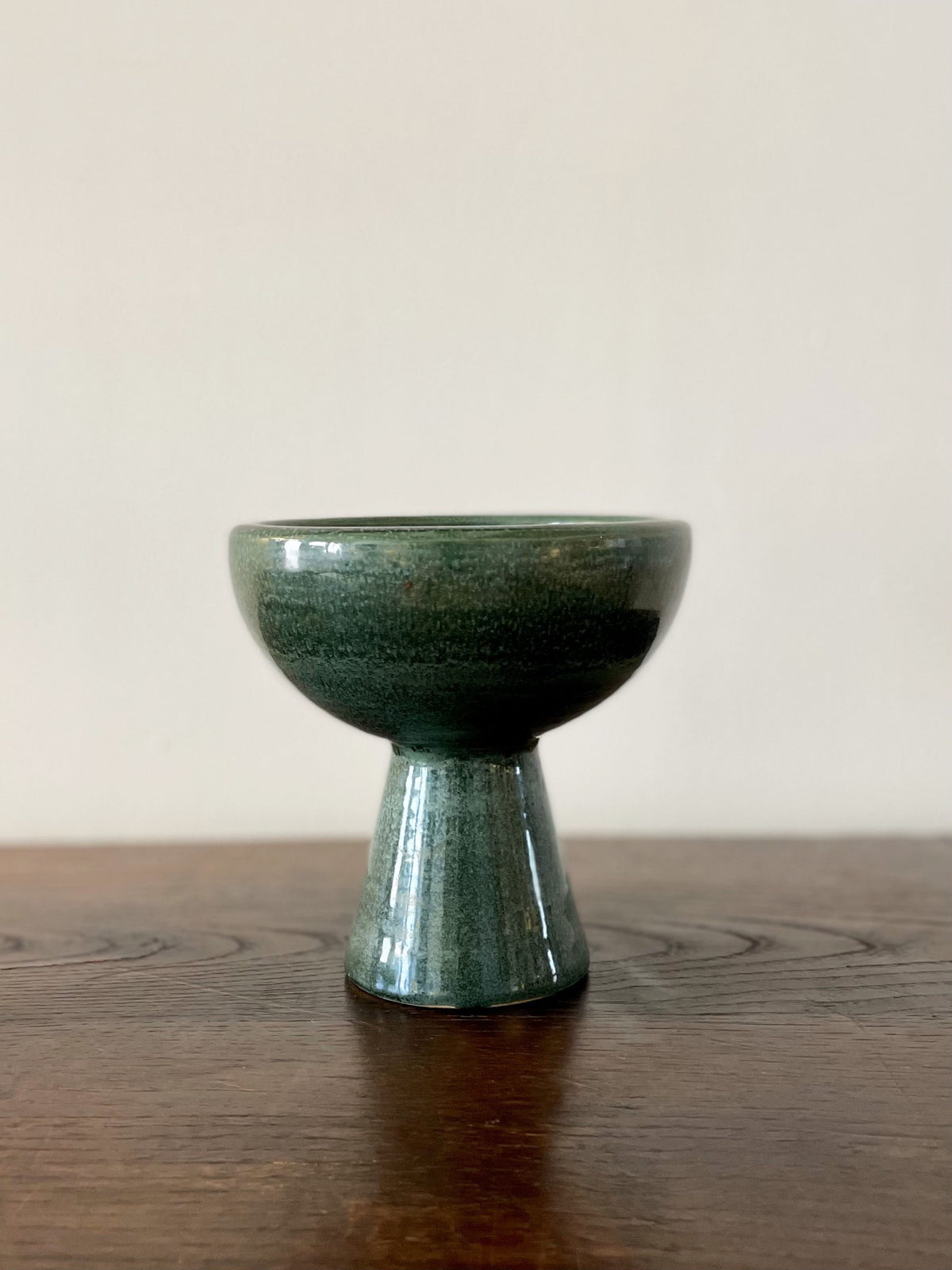 Glazed green ceramic cup