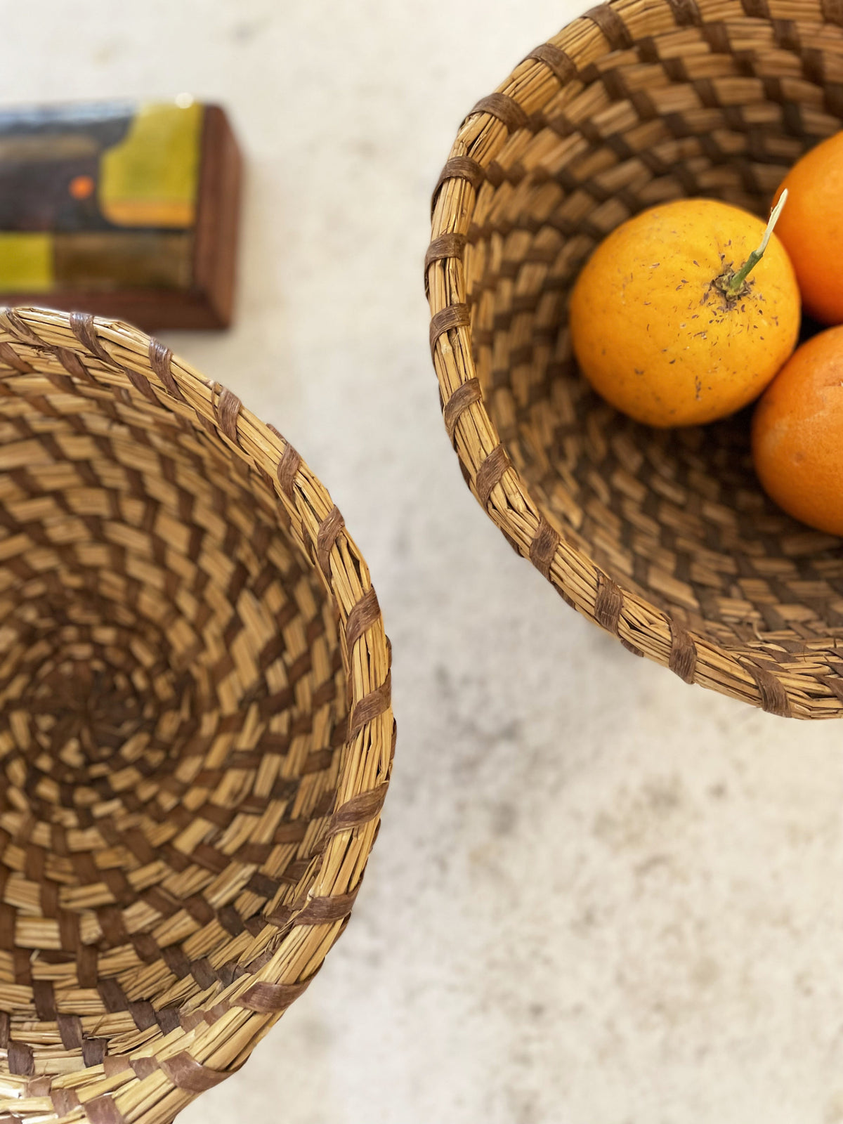 Pair of woven straw bowls
