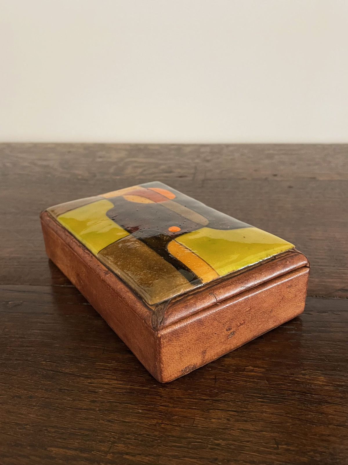 Leather box with polychrome ceramic lid