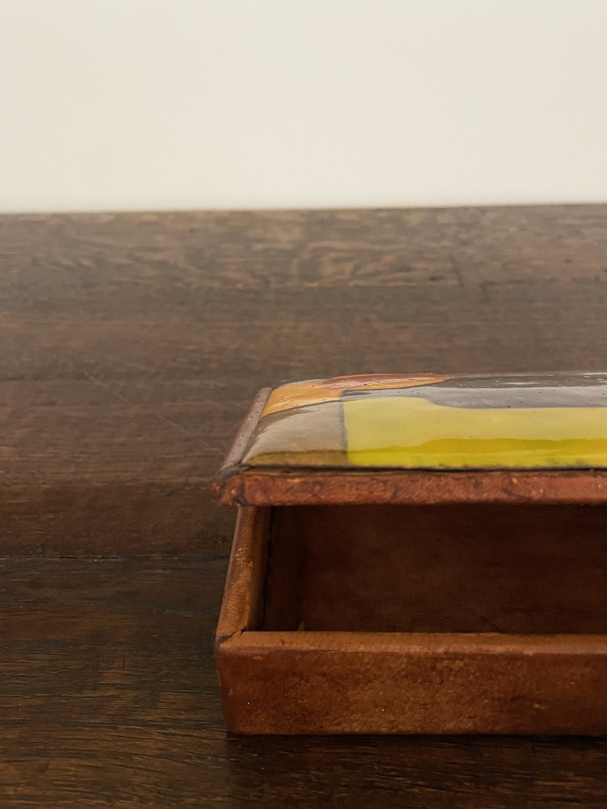 Leather box with polychrome ceramic lid