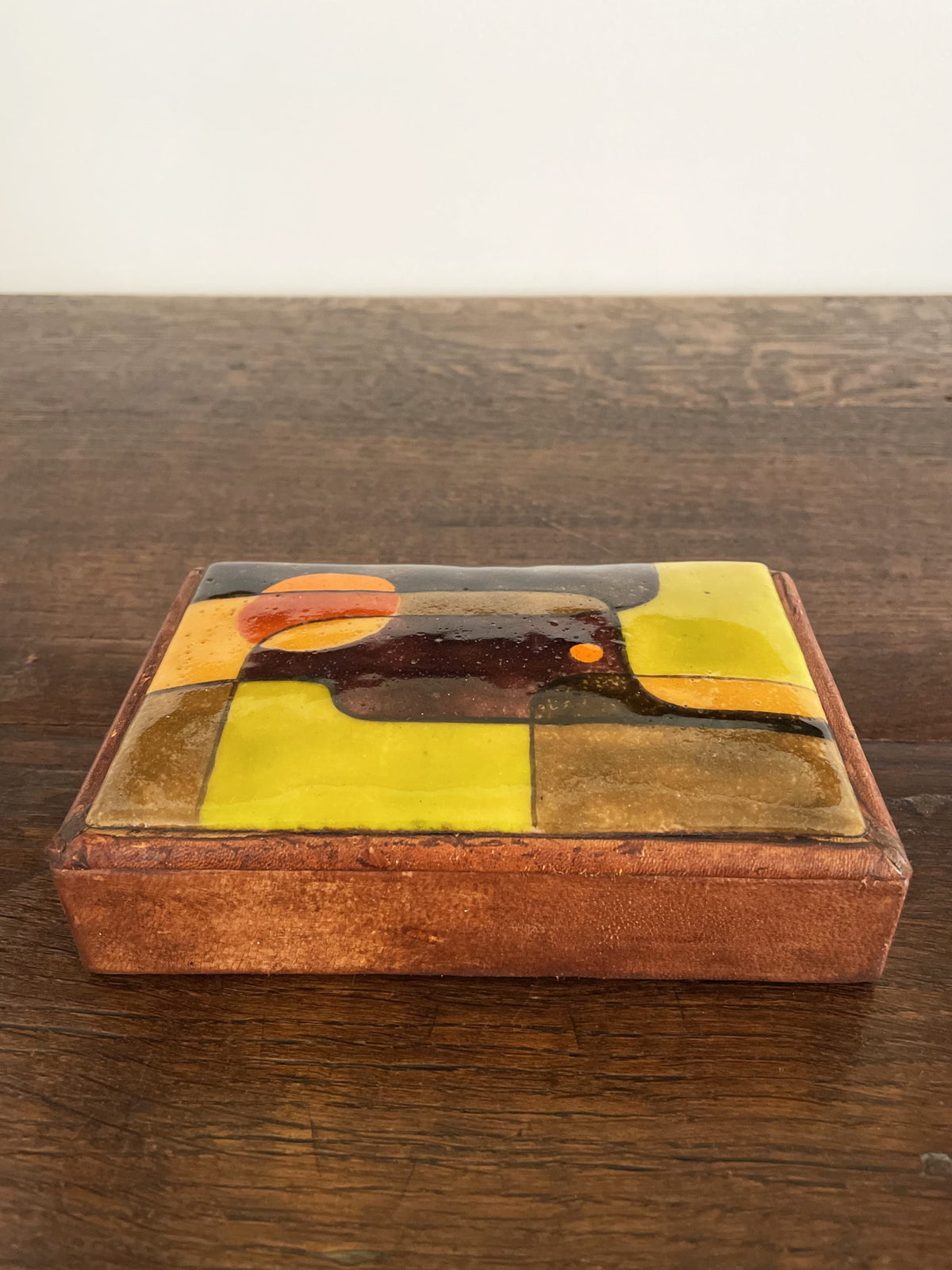 Leather box with polychrome ceramic lid