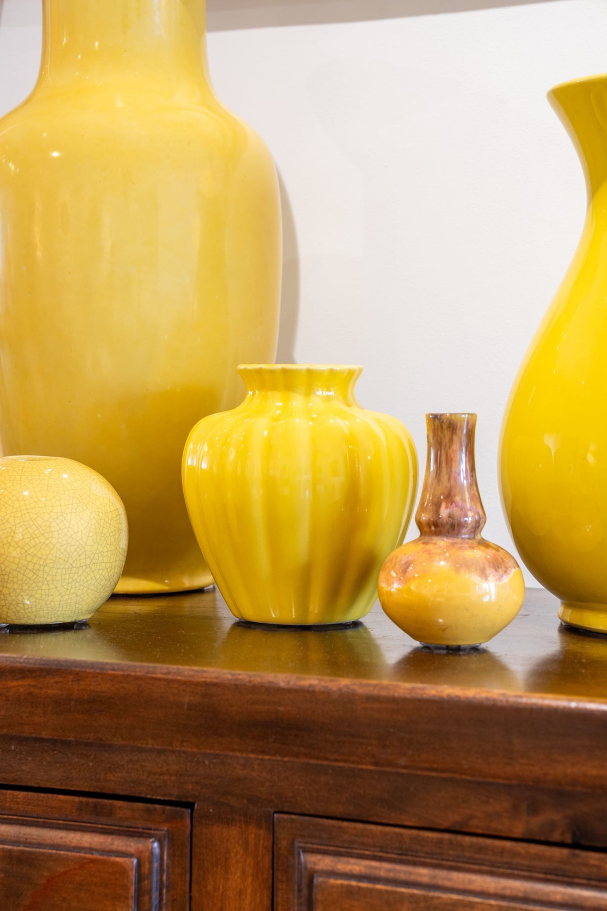 group of yellow glazed ceramic vases