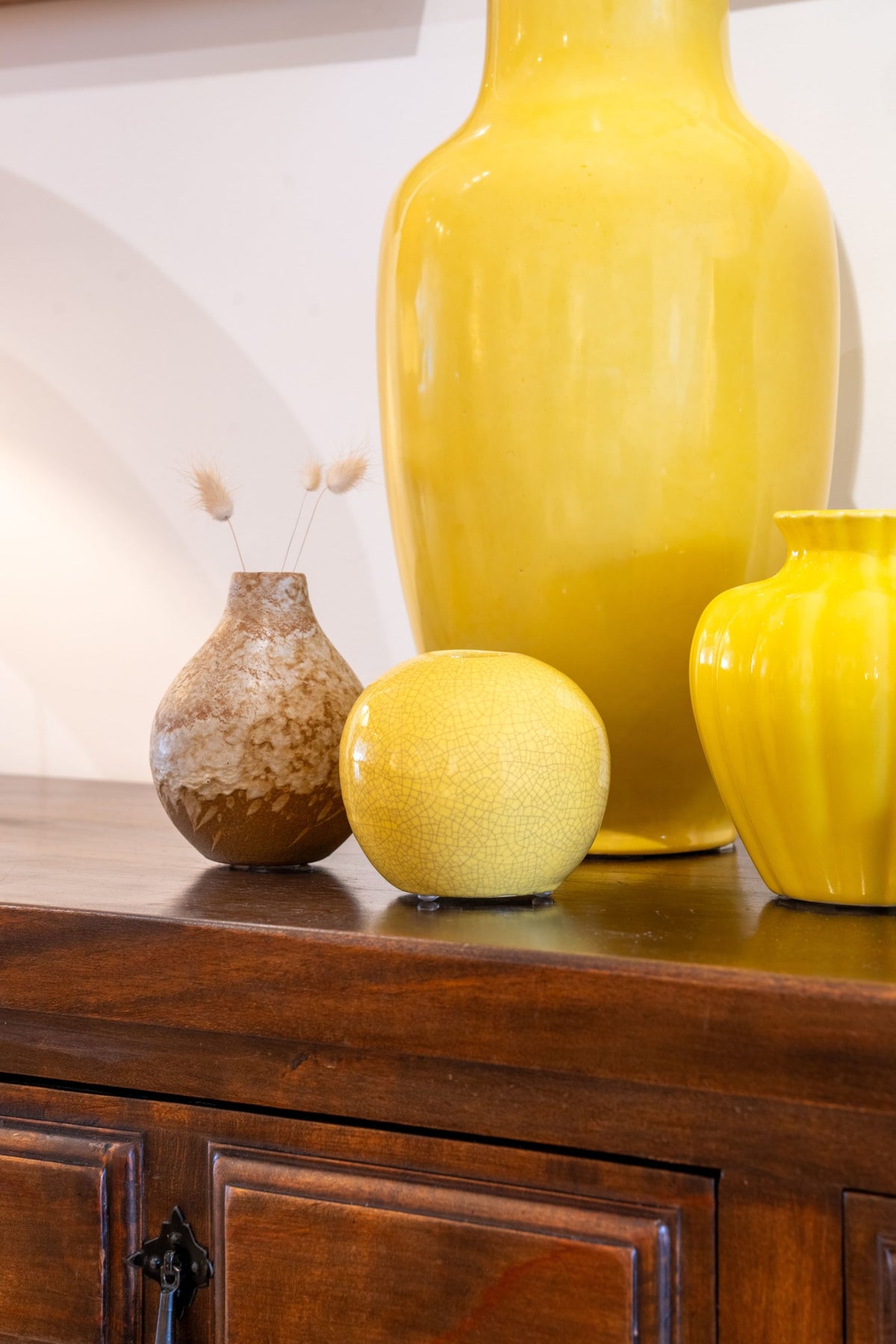 group of yellow glazed ceramic vases