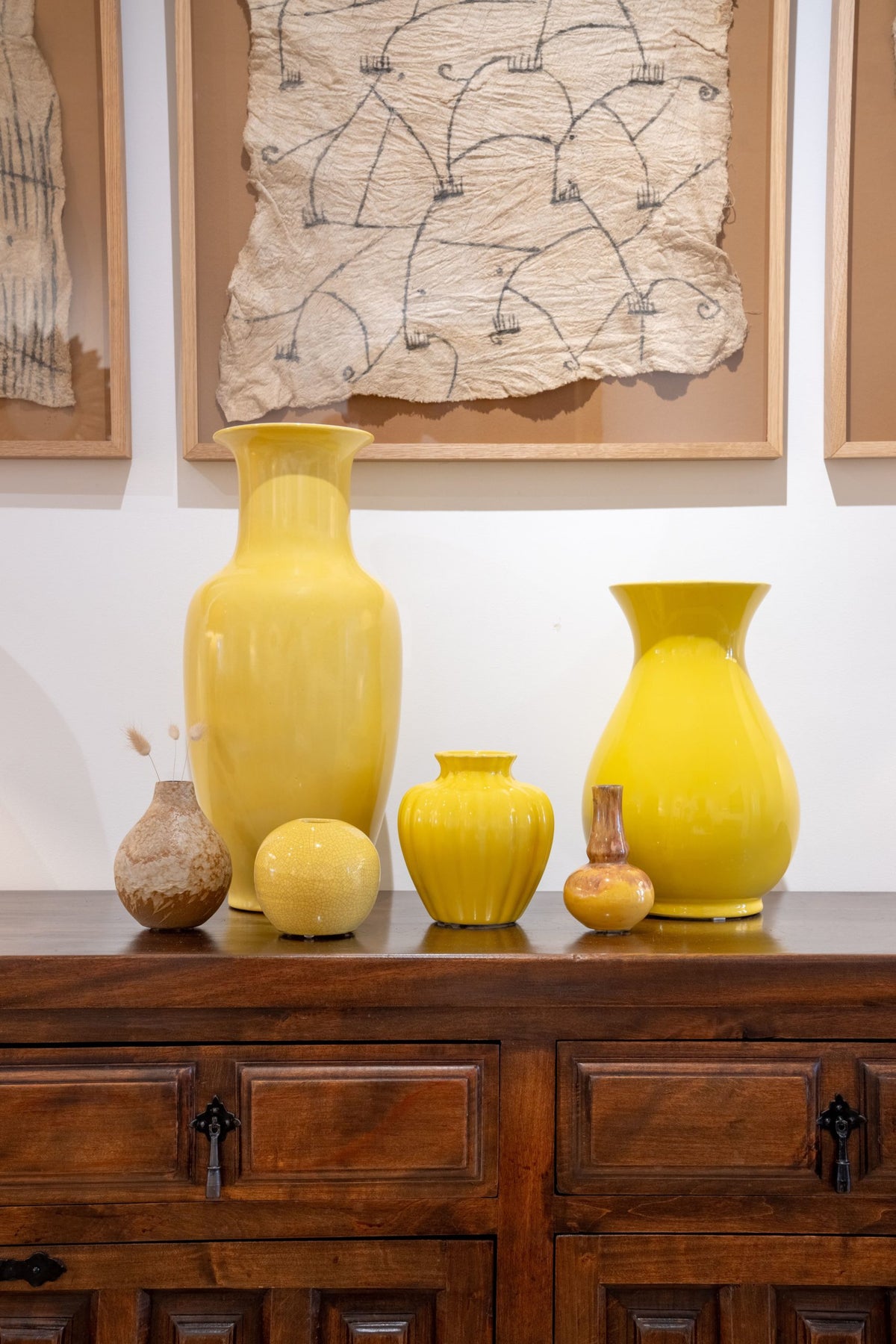 group of yellow glazed ceramic vases