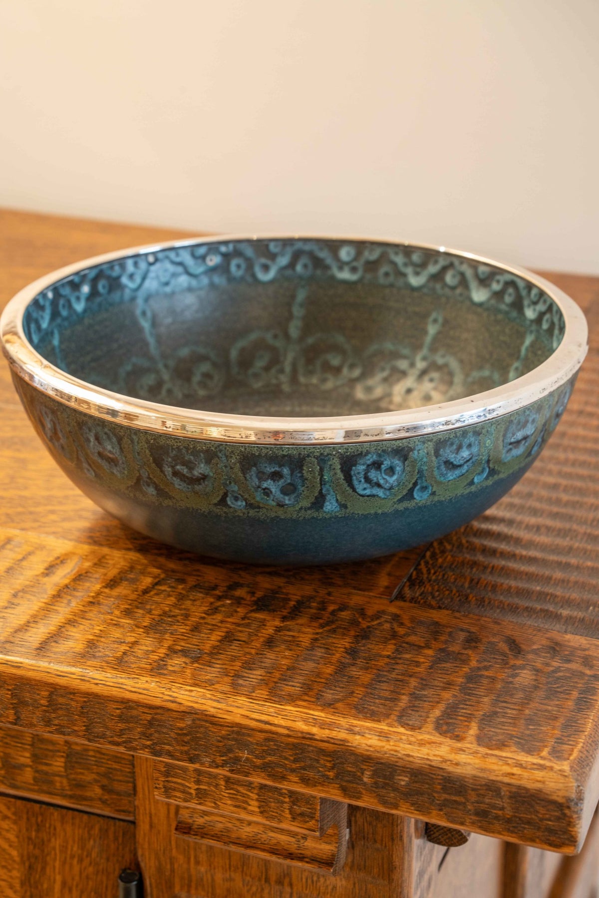 Large ceramic and silver-plated metal bowl