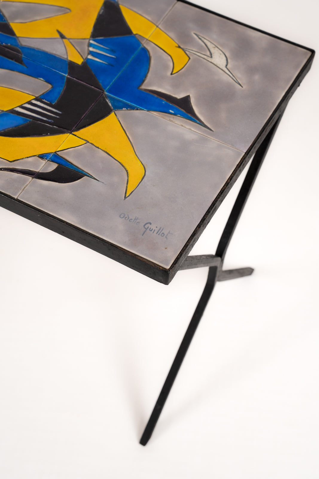 Wrought iron and glazed ceramic side table