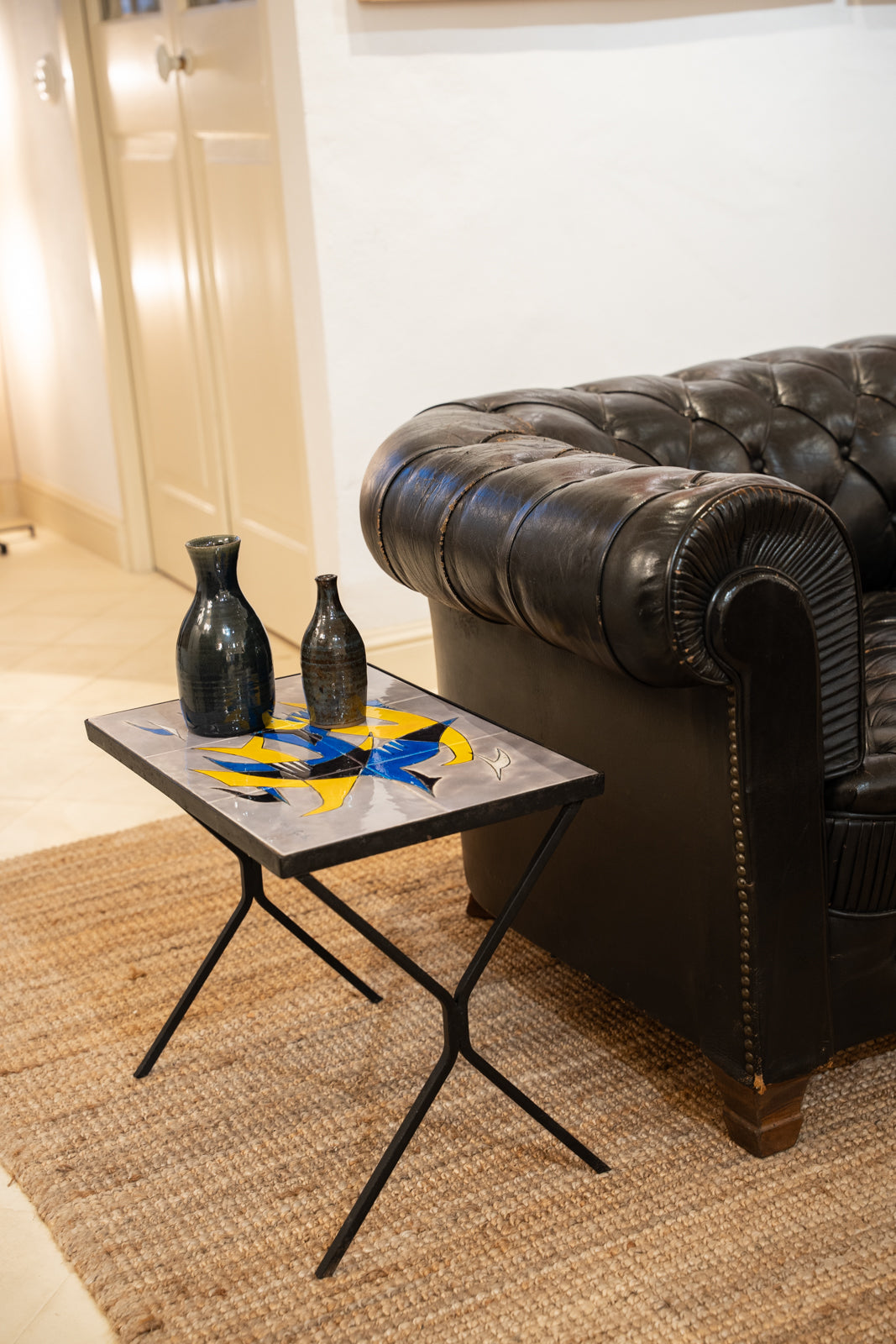 Wrought iron and glazed ceramic side table