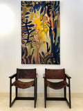 A pair of leather and beechwood chairs